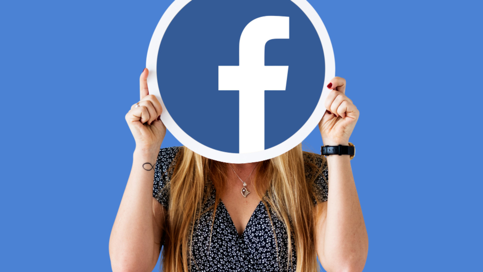 woman-showing-facebook-icon