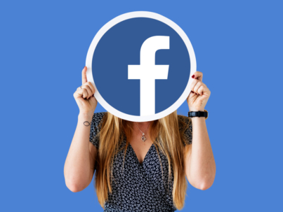 woman-showing-facebook-icon